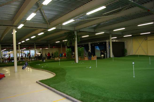 Indoor putting green in open commercial space